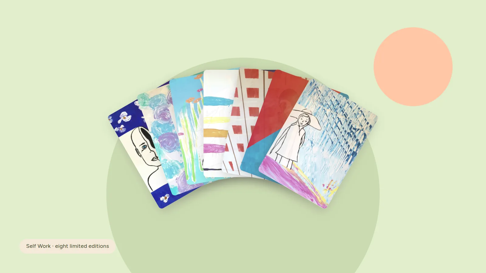 Seven Self Work limited edition cards fanned out over sage circles